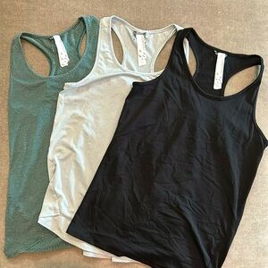 Bundle of Oiselle flyout tanks - size 8